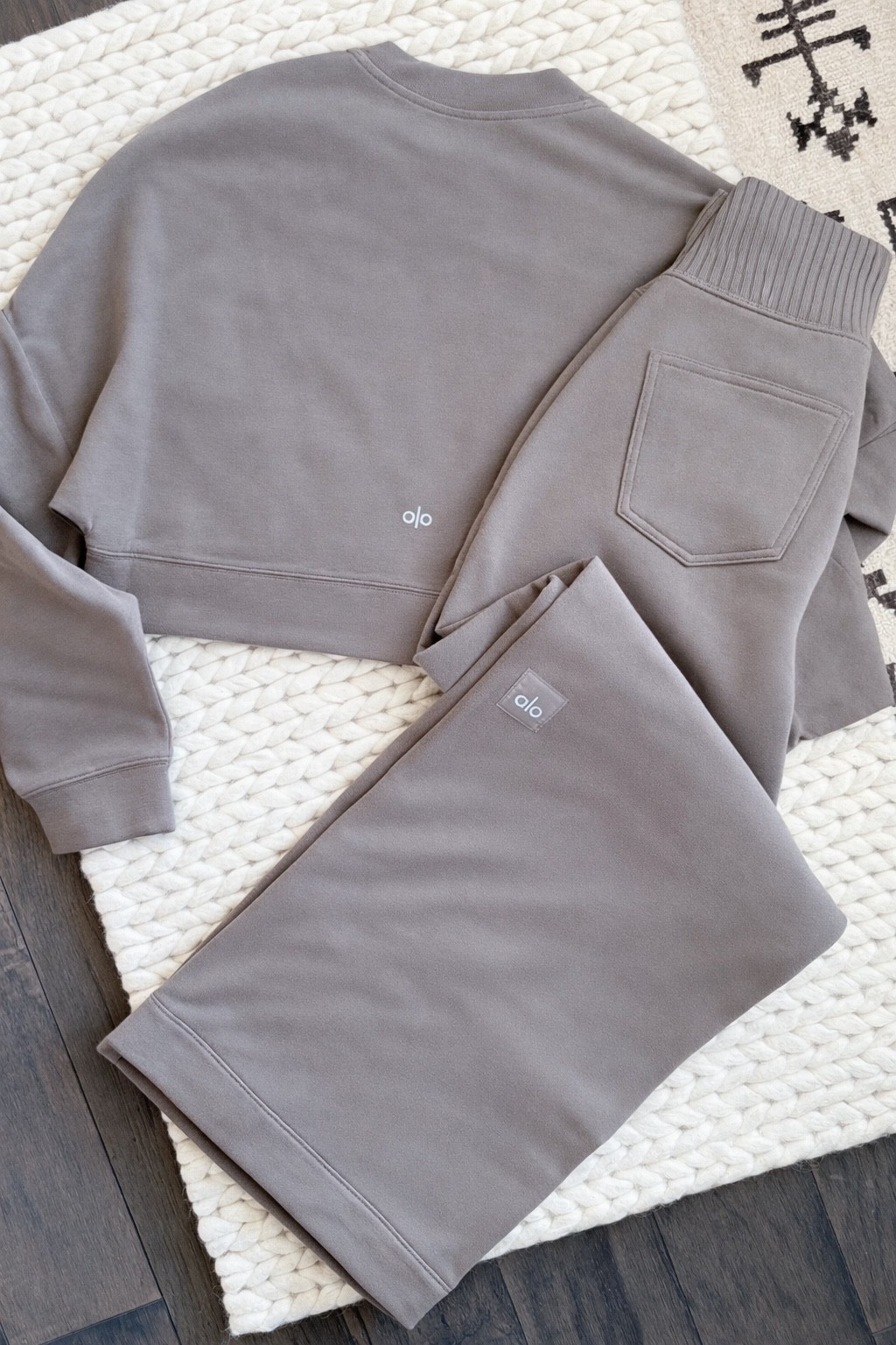 This alo set has been on rotation & I do not see that changing anytime soon. The Cropped Sway Crew Neck Pullover & the Serenity Wide Leg Sweatpant in the color Olive Tree are so good together. The fabric is really substantial & the fit is exactly what I want in a lounge set. Equally good for running errands or staying home & doing nothing. Both pieces are linked on LTK.

Alo Yoga set - Alo Serenity set - Alo Cropped Serenity Coverup - Alo Serenity Wide Leg Sweatpant - Alo matching set - Alo lounge set - wide leg sweatpants - cropped sweatshirt - elevated loungewear - quiet luxury loungewear - taupe loungewear - neutral loungewear set - cozy outfit ideas - athleisure set - matching sweatsuit - Alo Yoga outfit - LTK fashion finds - loungewear for women - comfortable everyday outfit - Alo Yoga review - sweatpant set women - casual chic outfit - elevated basics - cozy neutral outfit - LTK style finds​​​​​​​​​​​​​​​​

#LTKvlog #LTKActive #LTKmomlife