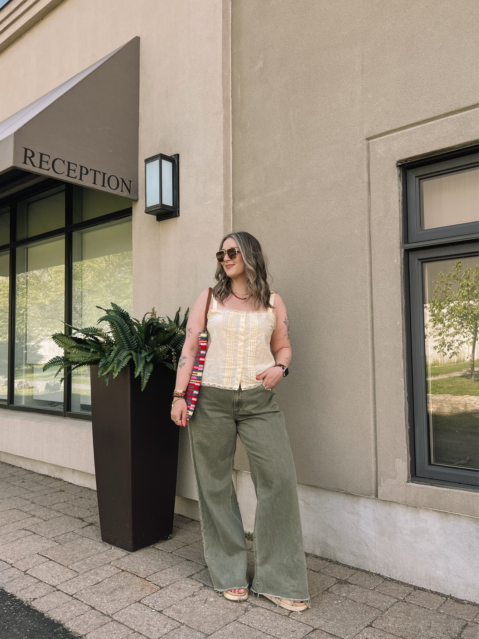 Colorful summer outfit! Wearing my usual L in the butter yellow tank top. Wearing 32 long (should have done 31) in the jeans. Also cut the hem for a custom length! Canadian top & bag links under “similar products”. Linked similar platform sandals

#LTKsummer #LTKjeans #LTKmidsize