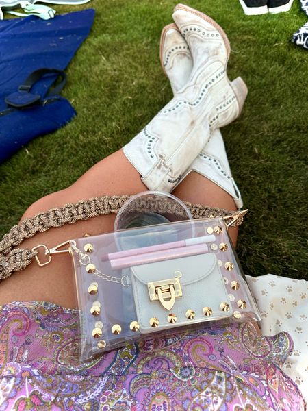 Use code: wifeonadime for 15% off my favorite Tarte lipstick and liner! Soft pink is the perfect mauve nude for me. 

Favorite white cowgirl boots are Idyllwind and are TTS. Can’t link the Shania Twain T-shirt because I got it at the concert but I’ll link some options! Clear concert crossbody and rhinestone strap were perfect. 
Sized up in the odd the shoulder sundress because it’s juniors.

#cowboyboots #countryoutfit #kendrascott #clearbag #clearcrossbody #concertbag #sundress #offtheshoulderdress #summerconcert #rhinestonebagstrap #bagstrap

#LTKcurves #LTKbeauty #LTKstyletip