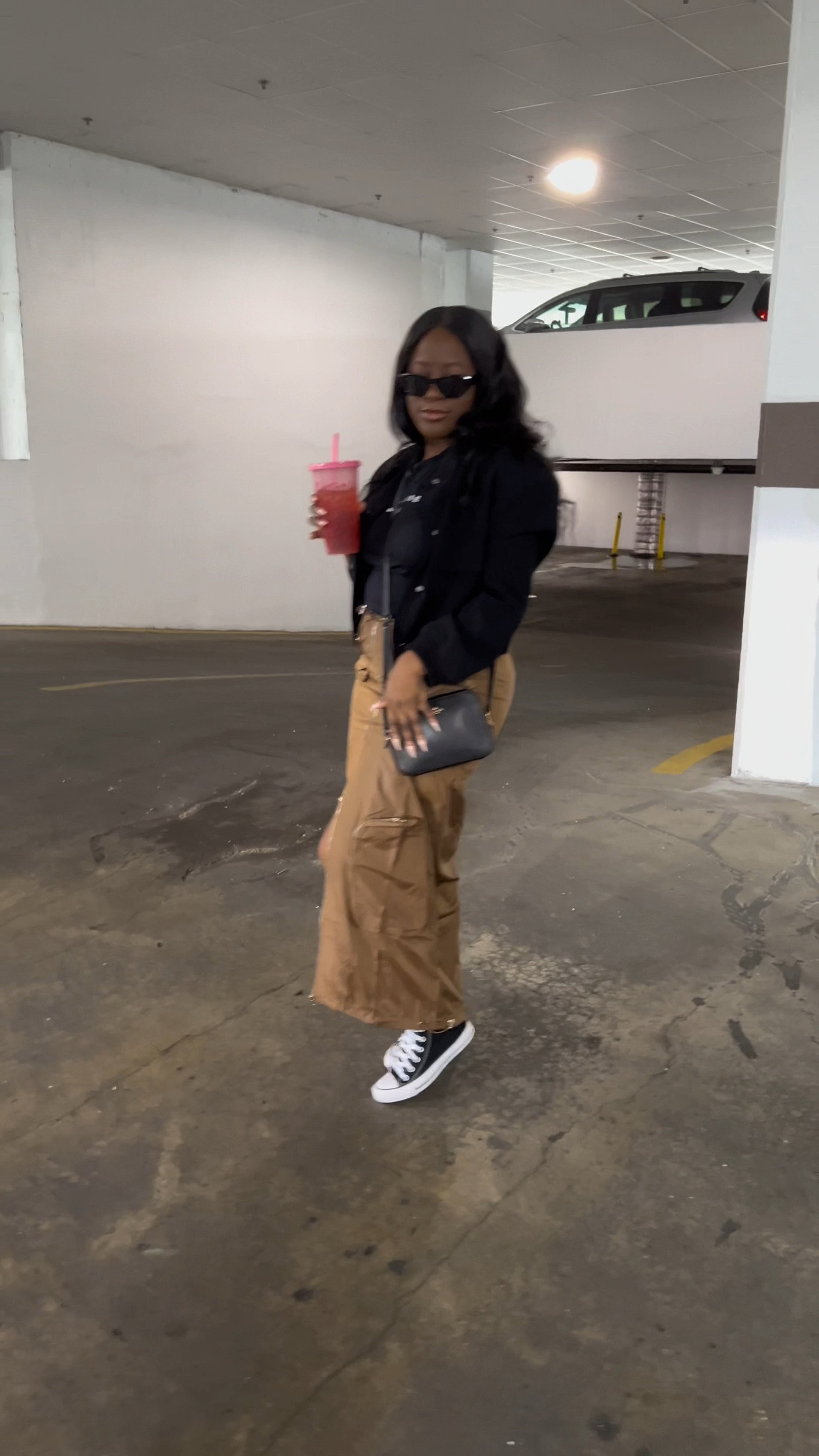 Black bomber jacket // black tee shirt // brown cargo midi skirt // black converses // Fall Outfits

#LTKVideo #LTKstyletip #LTKSeasonal