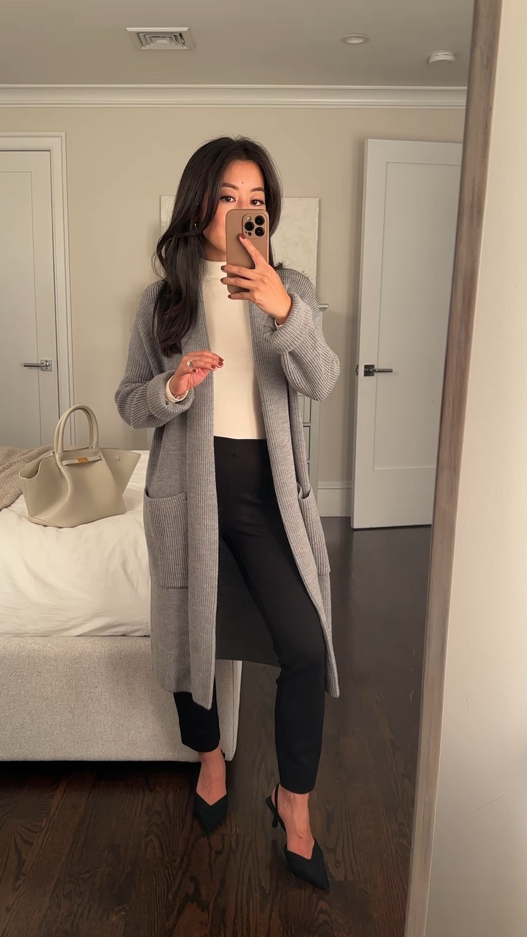 This $89 cardigan jacket made it to my Fall capsule wardrobe and would make a nice gift as well! 

Cozy and substantial weight, 100% merino wool. Smooth against the skin with no itchiness. 

Linked a few other Quince pieces in the same color that could be layered under. 

• Quince Australian Merino wool duster cardigan xs 

• mock neck shirt xxs

• Quince ultra-stretch ponte pintuck ankle pants in black size xs, 25” inseam. Petite friendly and runs small IMO. These are a snug fit on me 

• old h&m heels 

@onequince #quincepartner 

Easy work outfit, Thanksgiving outfit ideas (pair with flat loafers and leggings or jeans), business casual office style. 

#LTKFindsUnder100 #LTKGiftGuide #LTKWorkwear