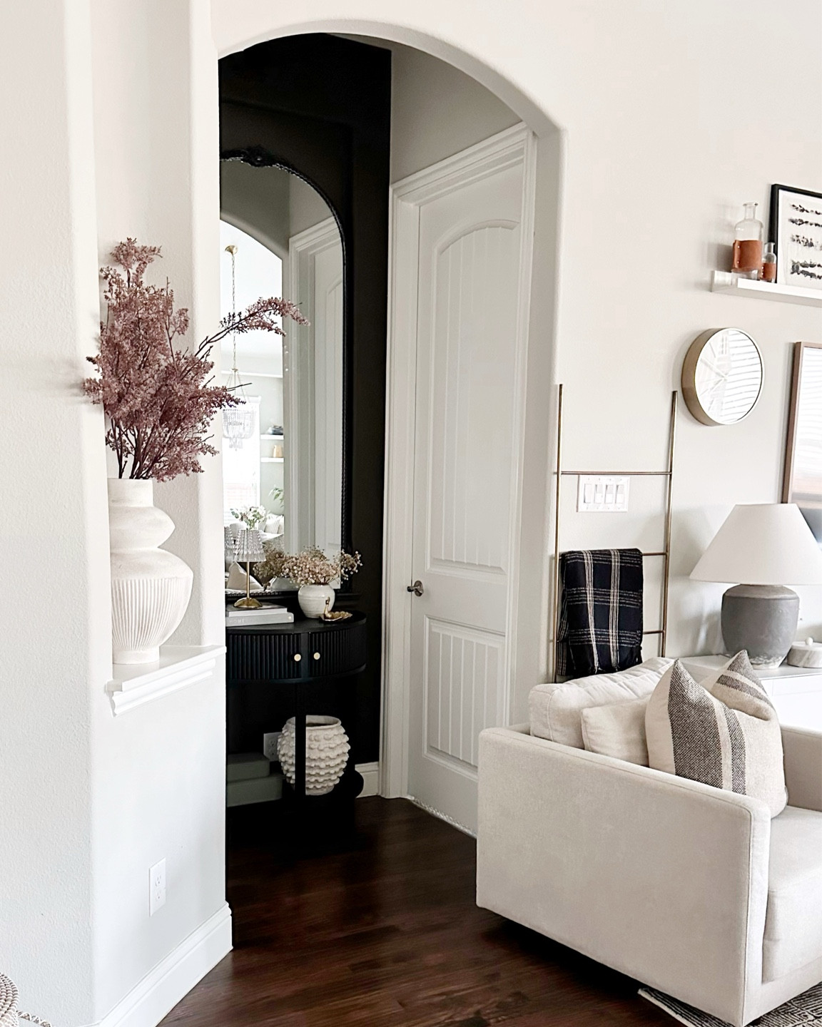 Loved transforming this art niche off our living area with this large ornate mirror and fluted half-moon table 

#LTKhome
