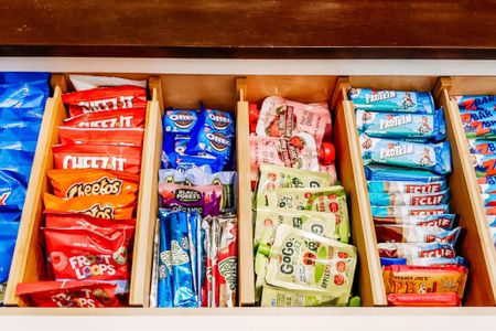 Who's hungry?! These bamboo tension dividers are perfect for keeping a snack drawer in organized order!

 