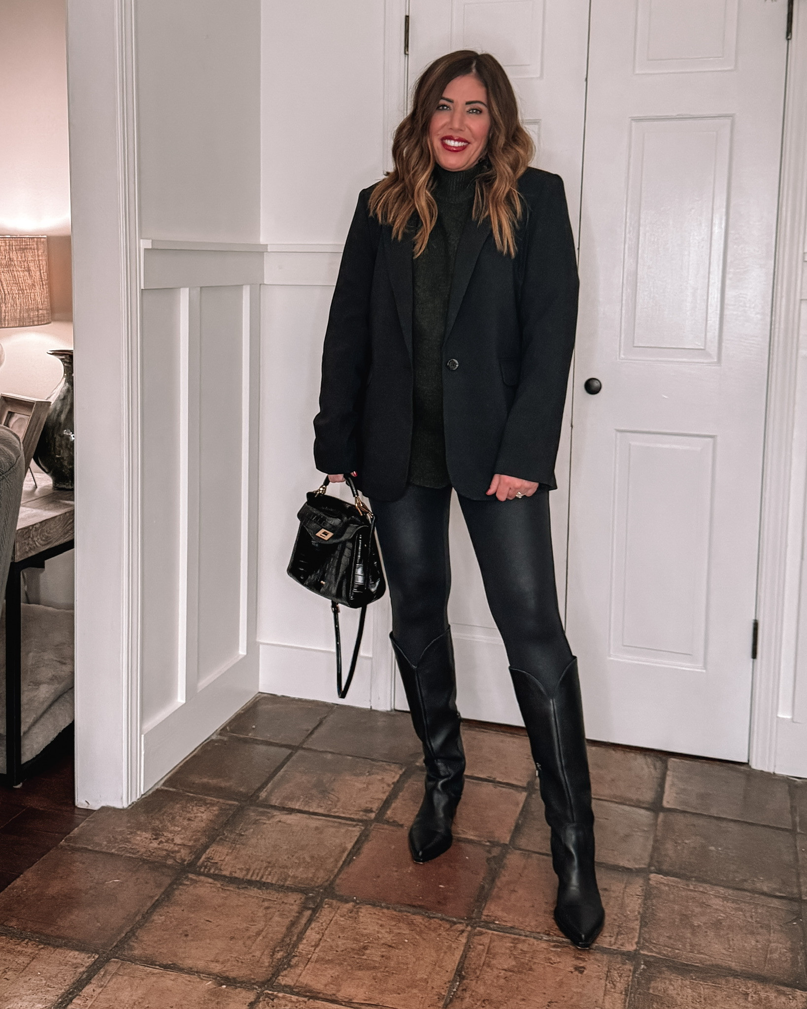 Throw on an Abercrombie blazer to elevate any outfit! I love an all black outfit, my blazer is a medium. I did a large in the sweater for an oversized look. I linked some other boot options as mine are not available.  

 #LTKgrwm #LTKMidsize #LTKFindsUnder100