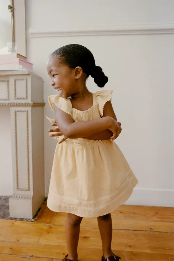 Dress with a straight neckline and short sleeves. Featuring bow appliqués on the sides, embroide... | Zara UK