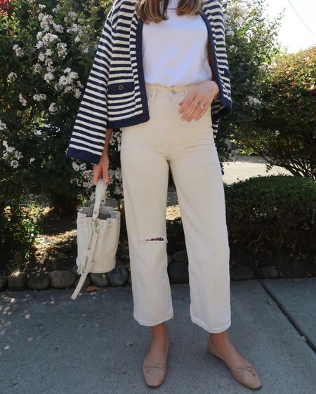 A spring look I love 〰️ ecru jeans, white tee, striped cardigan or sweater over the shoulders + the comfiest ballet flats. 🫶🏼 

#LTKFind #LTKunder100 #LTKshoecrush