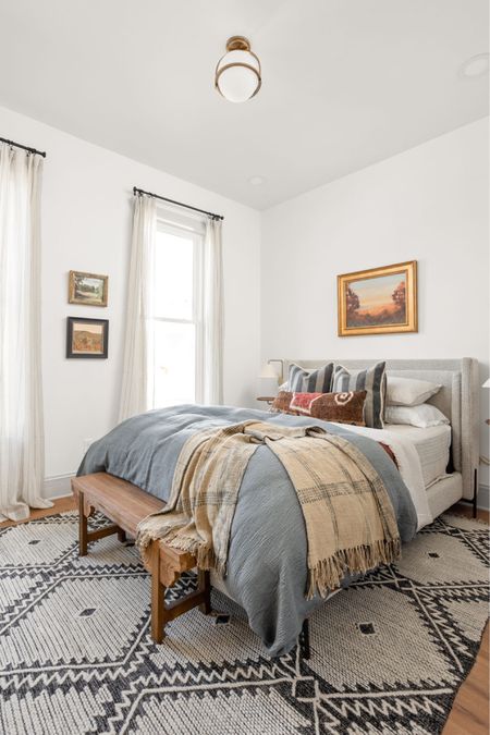 A cozy, peaceful bedroom created by lots of layered bedding.

#LTKhome