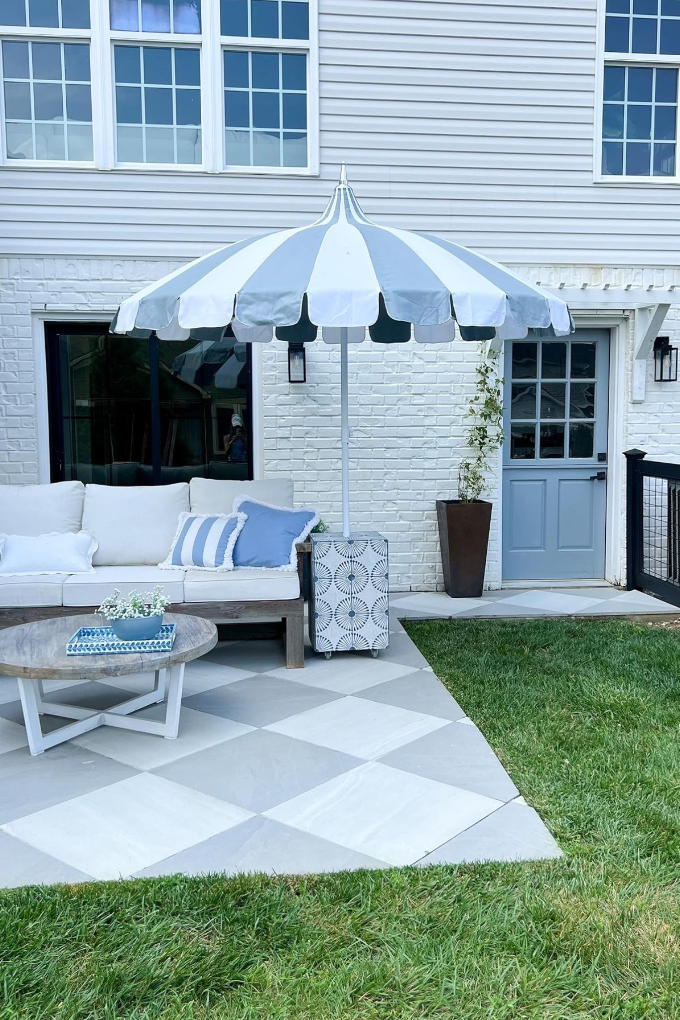 I fell in love with a Serena and Lily umbrella that looked identical to this one and was $1300. So I found a similar shaped one and painted it! It's held up beautifully. We use our patio so much more because of this sectional + umbrella stand/table 

#LTKSwim #LTKParties