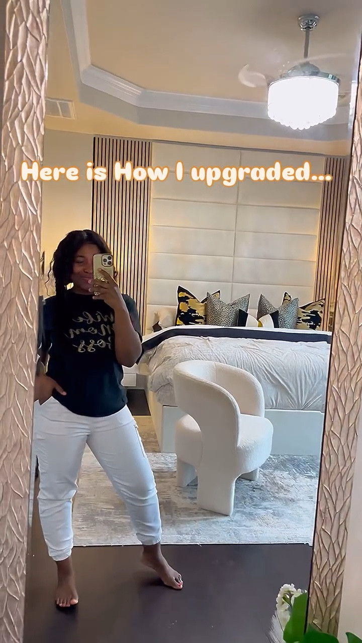 ⁉️Would you love to see what it Looked like before this ⁉️
If you’ve ever dreamed of waking up in a high-end hotel suite without the high-end price tag, let me show you how I transformed my outdated bedroom into a modern, cozy, and stylish retreat—all on a budget!

Here’s how I did it:

✅ VANT Panels & Platform Bed – The star of the show! These sleek, upholstered panels instantly elevated my space, giving my bedroom that sophisticated, luxurious feel. The matching platform bed tied everything together beautifully. @vantpanels 

✅ Wall Slats from Amazon – Adding vertical wood slats created an architectural touch that made the space feel more high-end. It’s such a simple DIY that adds so much texture and depth! @amazonhome 

✅ TOV Furniture Bedside Tables – These modern, chic bedside tables were the perfect addition to enhance the luxury feel. Their sleek design and high-quality finish seamlessly blend with the hotel-inspired aesthetic. @tovfurniture 

✅ Bouclé Accent Chair – Nothing says “cozy luxury” like a bouclé chair! This piece is not only stylish but also incredibly comfortable. It’s perfect for creating a small reading nook or just adding extra seating. @rossdressforless 

Would you love to see what it looked like before ? Let me know in the comments! And be sure to check out my YouTube channel @DEDESHOMEINTERIOR for more budget-friendly interior design inspiration! 

#LTKHome #LTKWatchNow #LTKFamily
