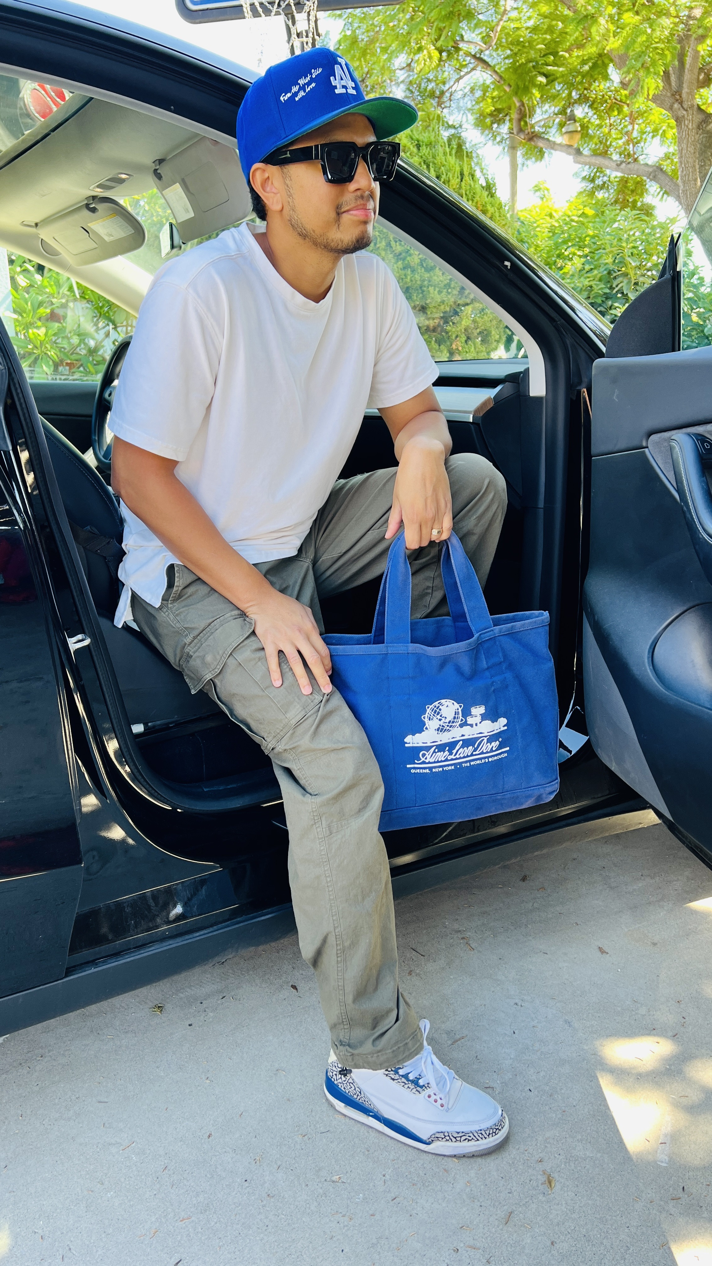 men's casual fashion, fall men's style, Uniqlo men's shirt, Nike Jordans outfit, Aime Leon Dore tote bag, Dodgers baseball cap style, men's sunglasses fashion, trendy men's fashion, streetwear men's look, autumn men's wardrobe, men's fashion accessories, relaxed men's style, men's outfit inspiration, modern men's clothing, everyday men's fashion, Tesla model y

#LTKMens #LTKShoeCrush #LTKTravel