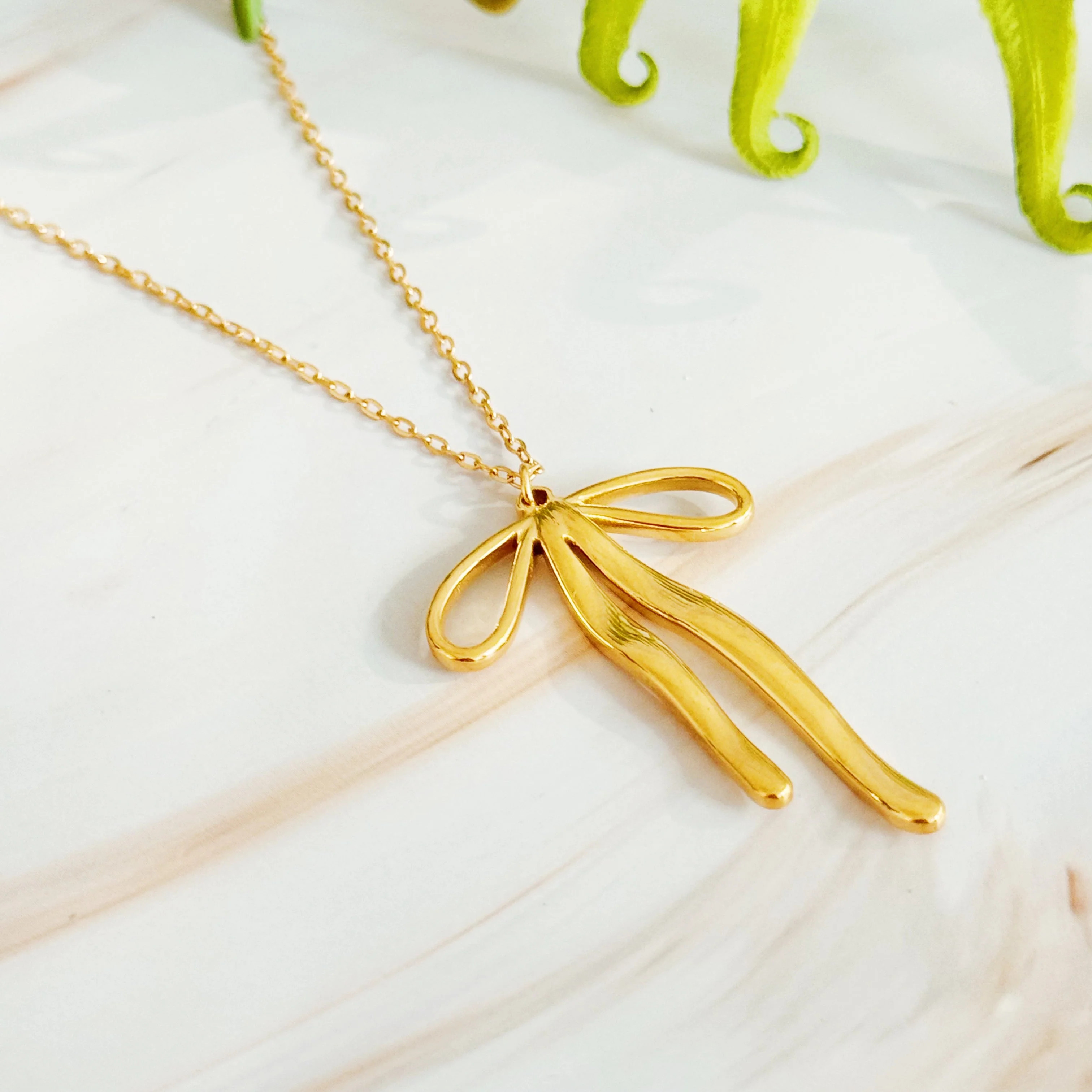 Stylist Bow Pendant Necklace | Casual Chic Boutique