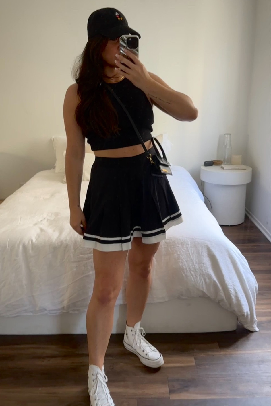 Disney Outfit Idea Four: H&M black tank top, pleated tennis skirt, White Leather Platform Converse, Black Mickey Mouse Hat.

#LTKtravel #LTKstyletip #LTKunder100