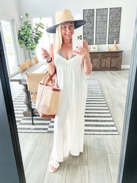 Love this white linen, wide leg swimsuit, cover up with floral sandals, a beach bag and straw hat. Size extra small linen cover-up. Beach vacation swim bathing suit cover up.

#LTKover40 #LTKswim #LTKSeasonal