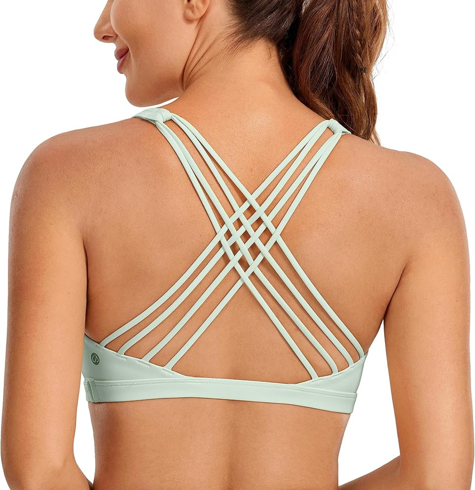 CRZ YOGA Strappy Sports Bras for Women - Criss Cross Back Sexy Wireless Padded Yoga Bra Cute Work... | Amazon (US)