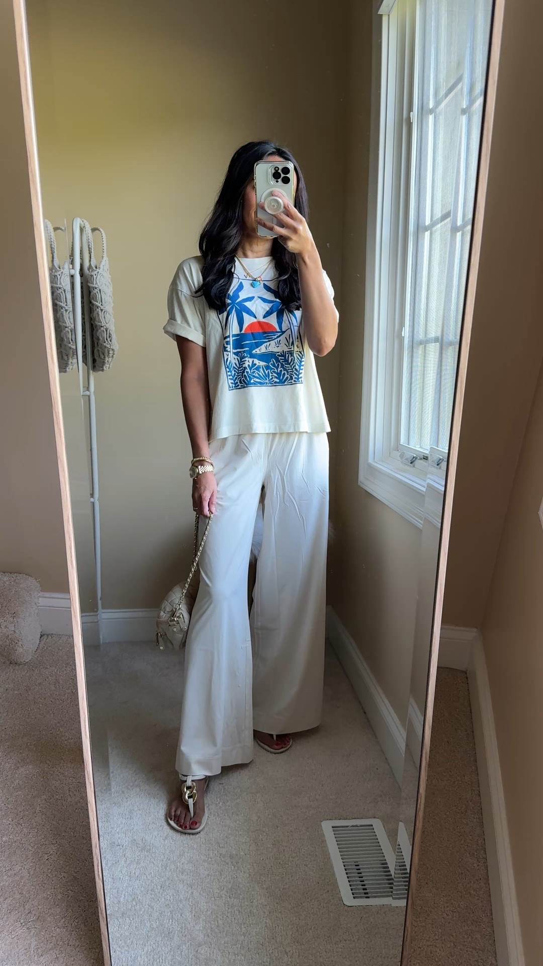 Vacation. Travel pants. 
Lightweight easy breezy widening leg pants made of athleisure material can be dressed up or down. Fit is flattering. True to size and I have the short length at 5’4. 
Thong sandals. T-strap sandals can be worn to pool or beach and dressed up for dinner. True to size. 
Mini bag for travel comes with 3 straps. 
Graphic t-shirt is cotton and has a cute fit  


#LTKSummerEdit #LTKTravel #LTKOver40