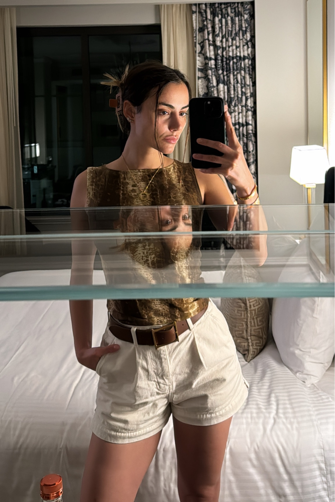 I have the belt in size 85 I think in here. Bottom size 26. Top size S.

Top:  88% TENCEL™ Lyocell, 12% Spandex
Belt: genuine leather 
Shorts: 100% Organically Grown Cotton

Brown top, ivory denim shorts, brown belt, brown hair claw, brown cowboy boots

#LTKStyleTip