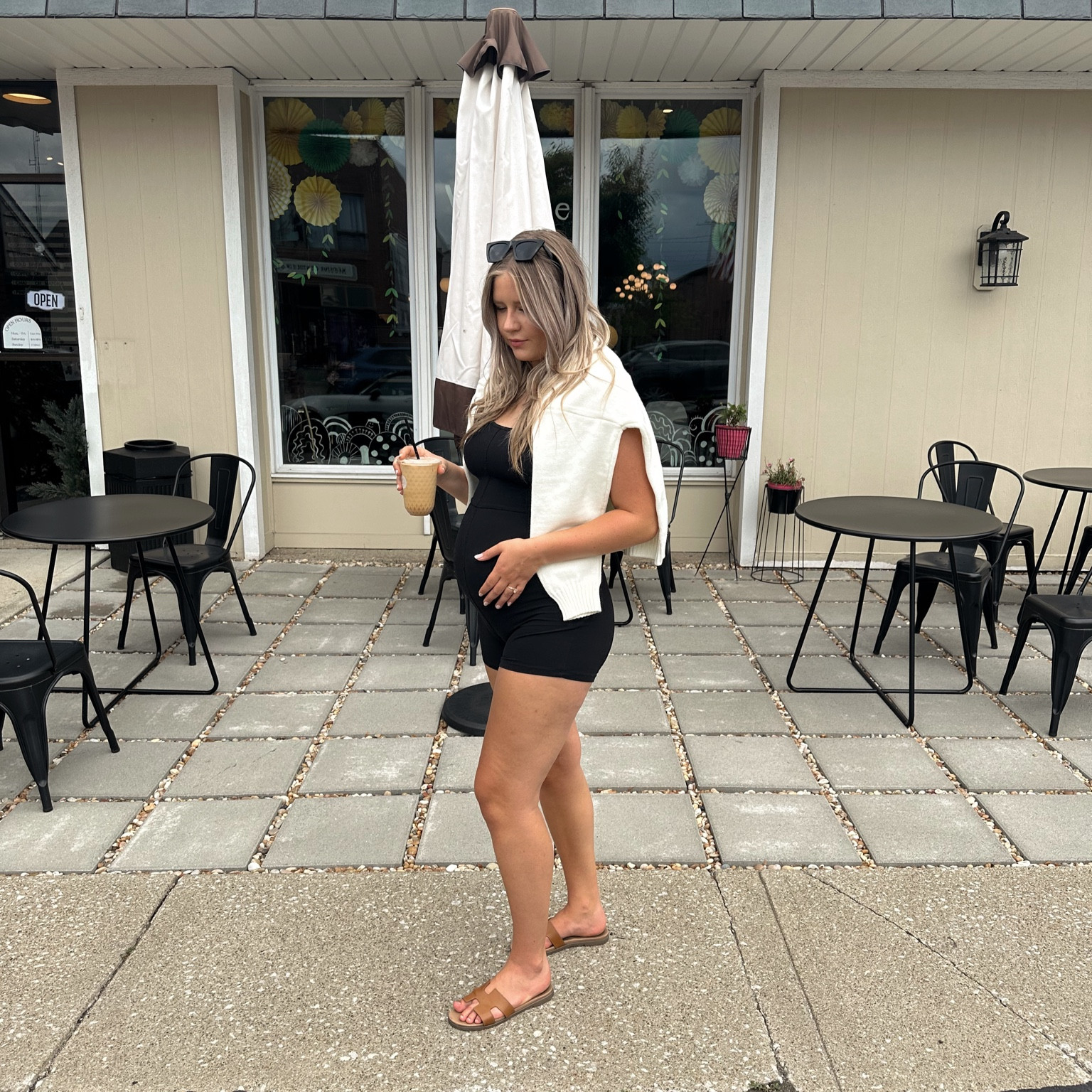 the perfect august coffee shop or errands outfit - comfortable, easy, but still classic & stylish 🤍 we love a minimal effort look!
• black one-piece romper/jumpsuit 
• cream sweater 
• tan steve madden sandals (oran sandal dupes) 
• black sunglasses to complete the look 

#LTKFindsUnder50 #LTKActive #LTKBump