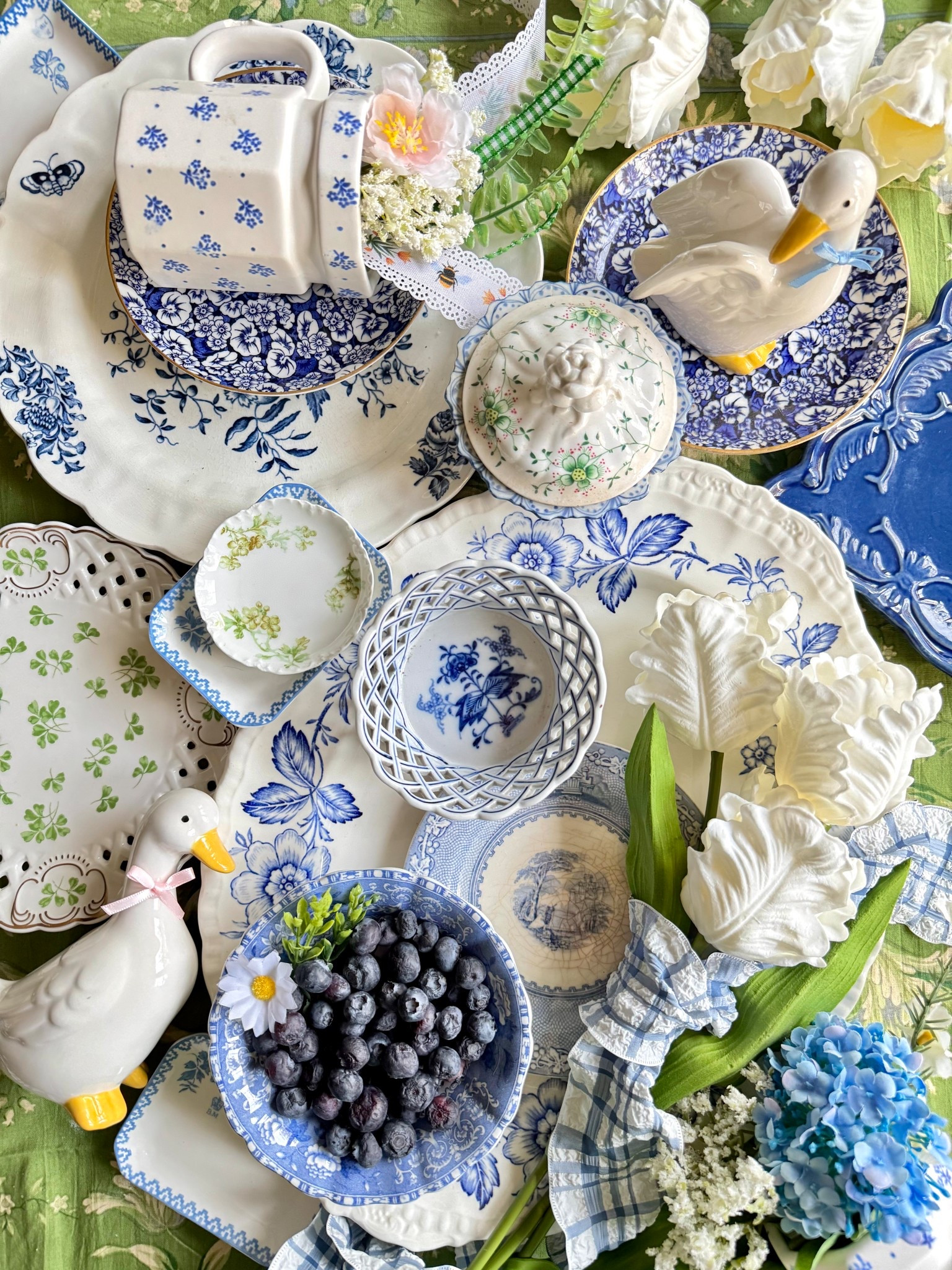 Spring is in the air, and I’m feeling inspired by all things blue, white, and floral! This week’s flatlay is a mix of vintage charm and fresh seasonal touches—delicate china, classic gingham, and sweet little details (how cute are the ducks?!). If you love timeless cottage style, I’ve linked some of my favorite finds to help you bring this look to your home. Shop it all on my LTK! ✨💙🌿 #SpringTablescape #BlueAndWhiteDecor 

#LTKHome