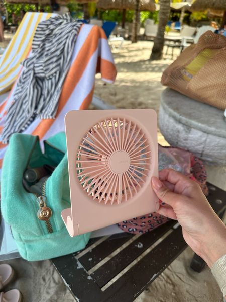 This portable fan has changed my life. I take it everywhere! It also has a phone charger attached to it, which makes it even better. Of course I had to get a pink one, but there is also white & black. 

Linked below!
Portable charger, portable fan, travel essentials, on the go, phone charger, fan, beach

#LTKxPrime #LTKtravel #LTKfindsunder50