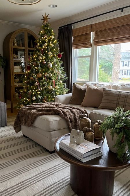 Cozy and minimalistic Christmas living room 

Arch cabinet
Fur blanket
Linen sofa
Velour pillows
Ceramic houses
Wood coffee table
Faux Christmas tree

#LTKHoliday #LTKSeasonal #LTKhome