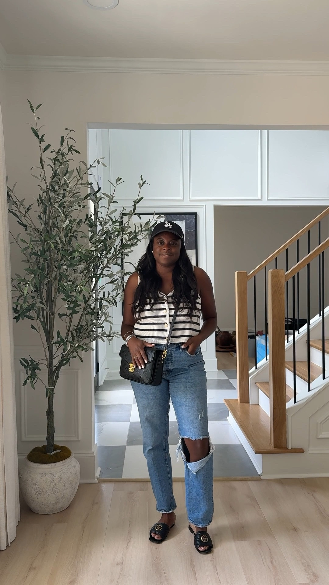 Outfit of the day, casual look, denim ripped jeans, striped v-neck sweater vest. 

#LTKMidsize #LTKStyleTip #LTKSeasonal