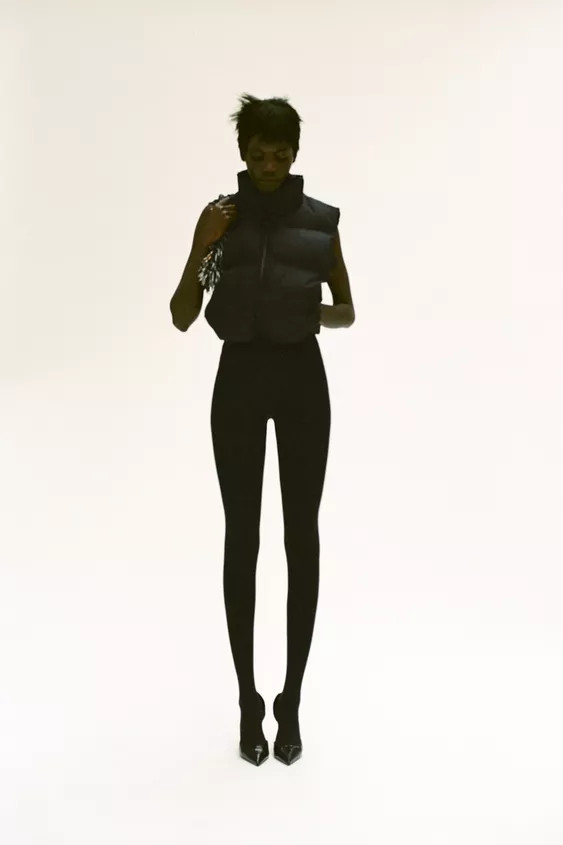 Water repellent vest with high collar. Side hidden in-seam zip pockets. Adjustable elastic drawco... | Zara US