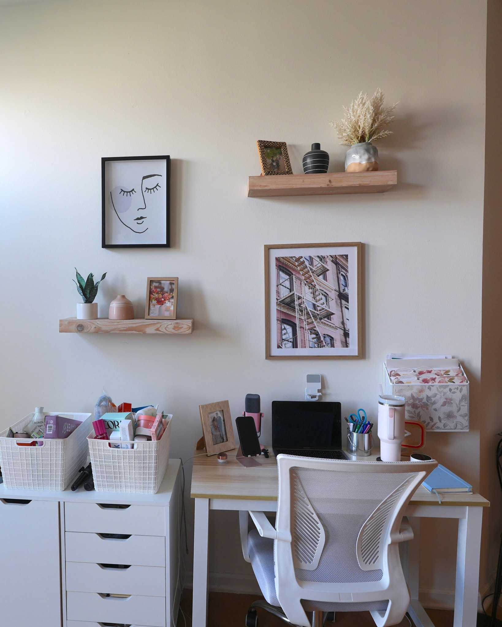 Here’s my little work-from-home corner! I keep things simple with a white desk and a clear acrylic chair that keeps the space feeling light and airy. Above my desk, I hung a few floating shelves for books, plants, and some framed art to keep me inspired throughout the day. A floor lamp in the corner makes sure I have good lighting for late-night editing sessions.

#LTKHome #LTKFindsUnder100