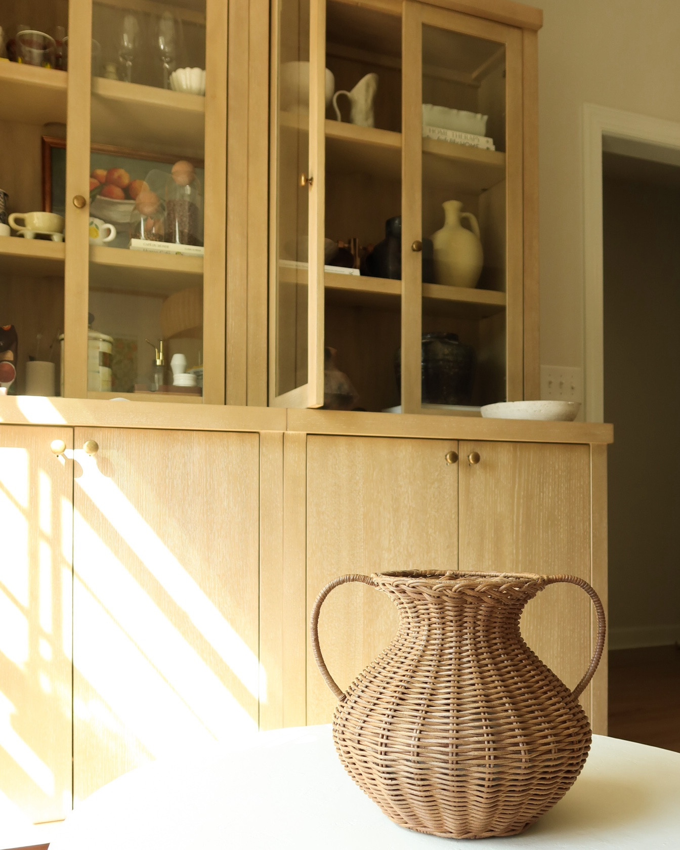 Styled curio cabinet- cabinets decor 
Vintage decor vases rattan vase handled vase coffee table neutral rug home 

#LTKSaleAlert #LTKHome #LTKFindsUnder50