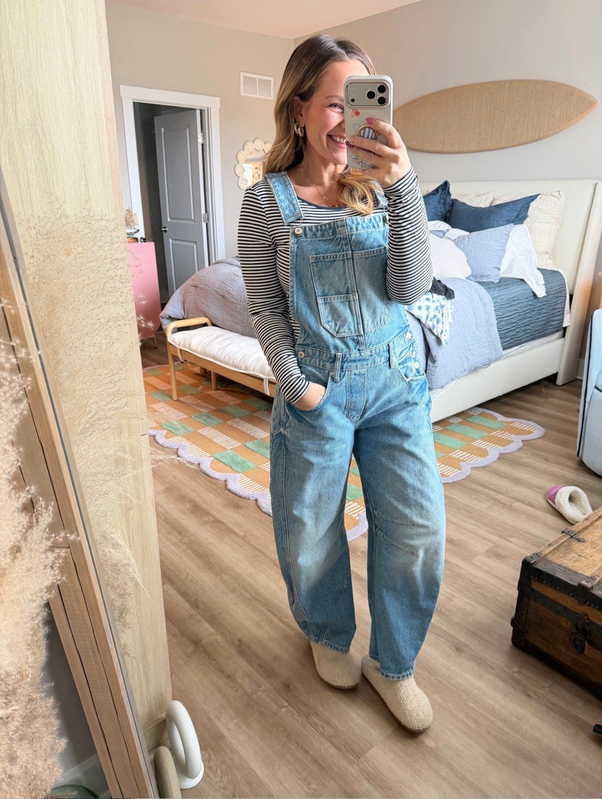 Okay this is peak effortless cool girl energy 👏🏼

Overalls are officially back and I’m not mad about it. These are the perfect relaxed fit — not too baggy, not too stiff — and they layer so well over a simple striped long sleeve. Easy, comfortable, and somehow still looks styled.

Wearing with cozy slippers here, but you could swap for sneakers or clogs and instantly change the vibe.

Fit notes:
• True to size
• Soft denim with structure
• Relaxed wide leg (so flattering)

Linking the overalls, striped tee, and slippers here 🤍 This is one of those outfits you’ll keep reaching for.