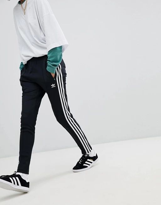 Adidas Originals adicolor three stripe track pants in black | ASOS UK