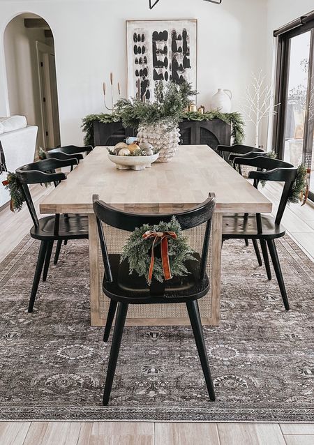 Mini wreaths for chairs 🌲✨ #diningroom #christmasdecor #christmaswreaths #target #modernorganic #blackdiningchair #canetable #enzochair #loloirug #diningroomrug #sideboard #holidaydecor 

#LTKhome #LTKSeasonal #LTKHoliday
