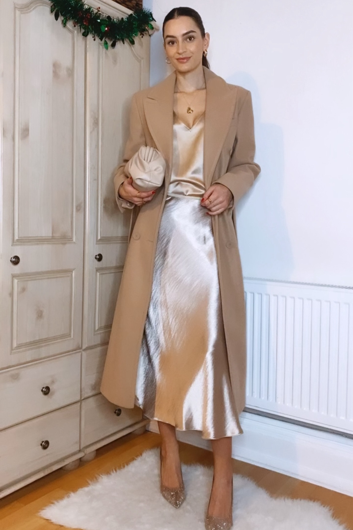 7 Days, 7 Party Outfits: Day 4
Camel coat, gold cami, gold slip skirt, beige clutch bag, sparkly heels, gold jewellery 

#LTKHoliday