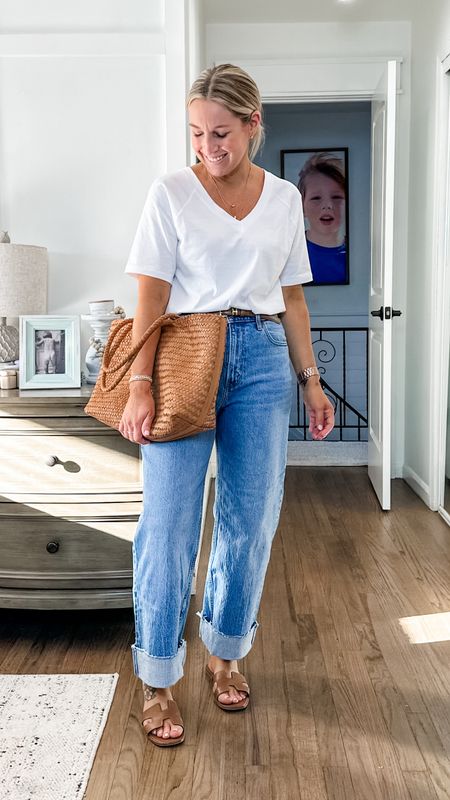 Probably one of my most favorite outfits and it’s so simple. I got a small tee and true to size 29 jeans in short. I cuffed them myself. This tote is everything and these have been my go to sandals for about 3 years. So classic. I sized up half  

#LTKfindsunder50 #LTKstyletip #LTKmidsize