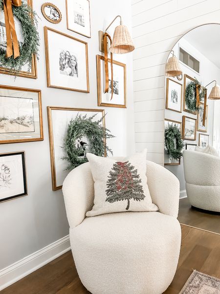 Love this cozy corner!

Christmas tree accent pillow, Christmas throw pillow, neutral swivel chair, gold rattan sconce light fixture, gold frames with mat, gallery wall, arched floor mirror.

#LTKSeasonal #LTKhome #LTKHoliday