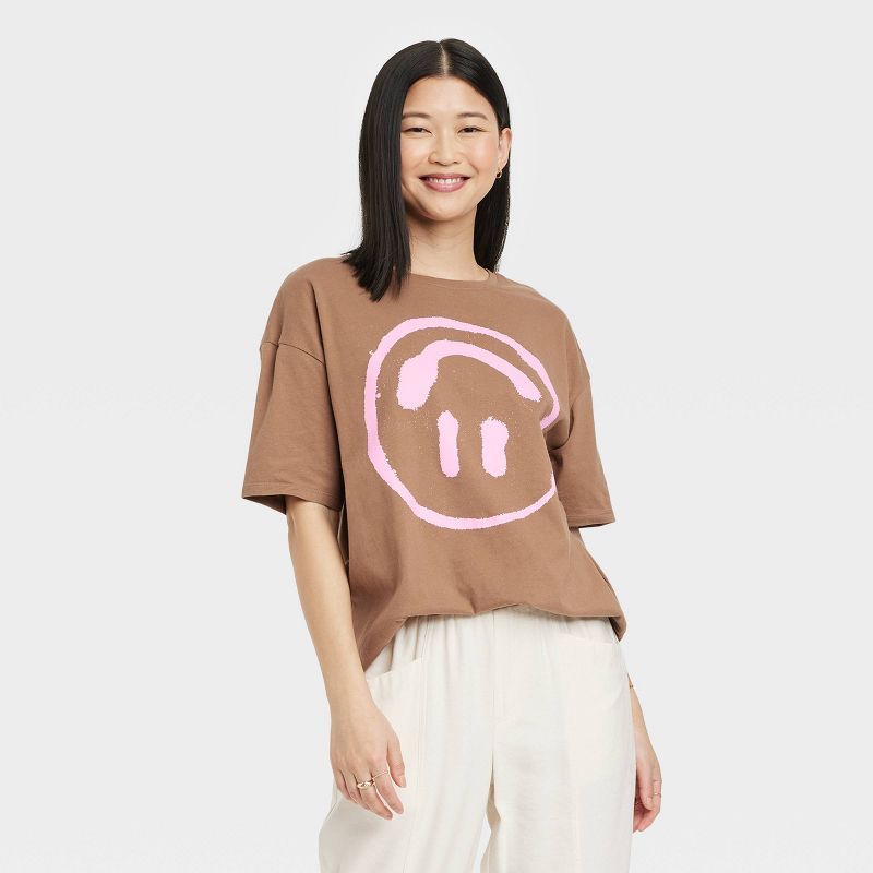 Women's Upside Down Smiley Oversized Short Sleeve Graphic T-Shirt - Brown | Target