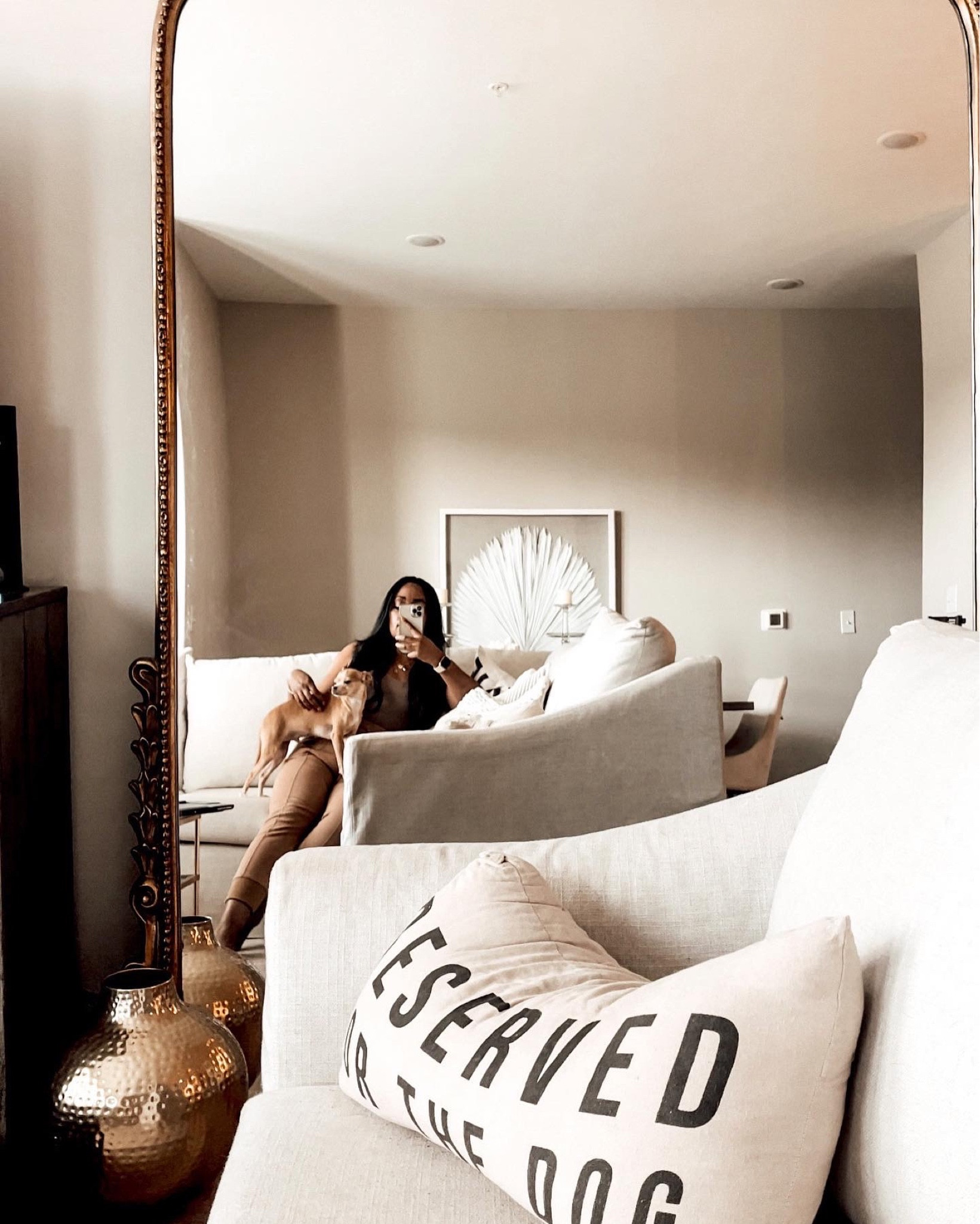 Styling the gleaming primrose mirror. Neutral living room. Apartment living 

#LTKstyletip #LTKSeasonal #LTKhome