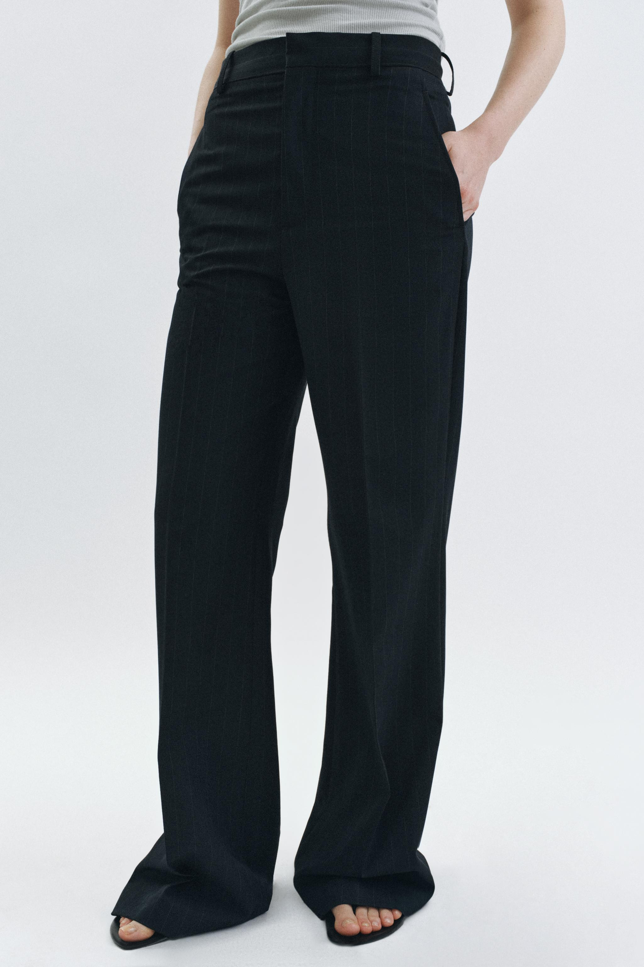 ZARA WOMAN COLLECTIONHigh-waisted pants with ironed front crease. Waistband with belt loops. Fron... | Zara US