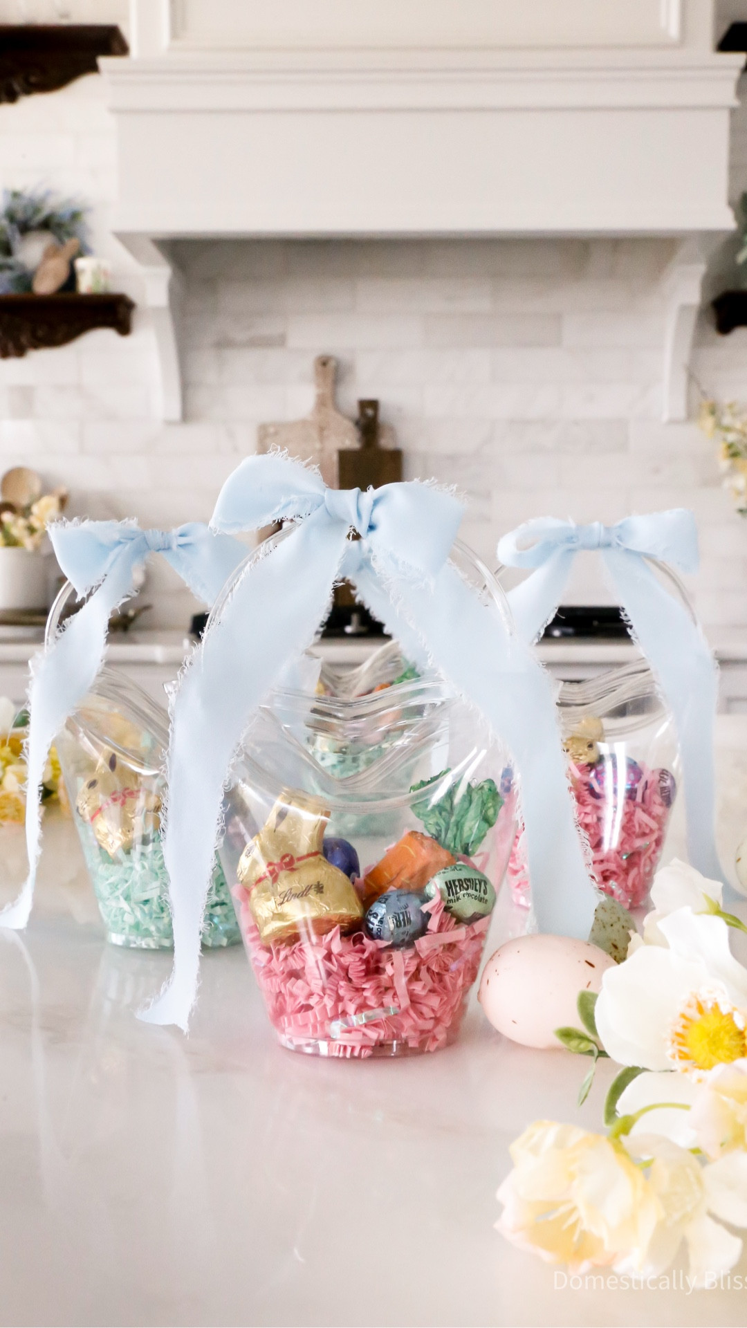 These Mini Easter Basket Cups are so easy to make!
You can customize them by adding your favorite Easter candy and any color of shredded crinkle-cut paper and ribbon.
You can find all the products I used to make these Mini Easter Basket Cups on my LTK.


🔗 Join our newsletter: https://domesticallyblissful.com/newsletter/ 

#LTKKids #LTKfoodie #LTKSeasonal