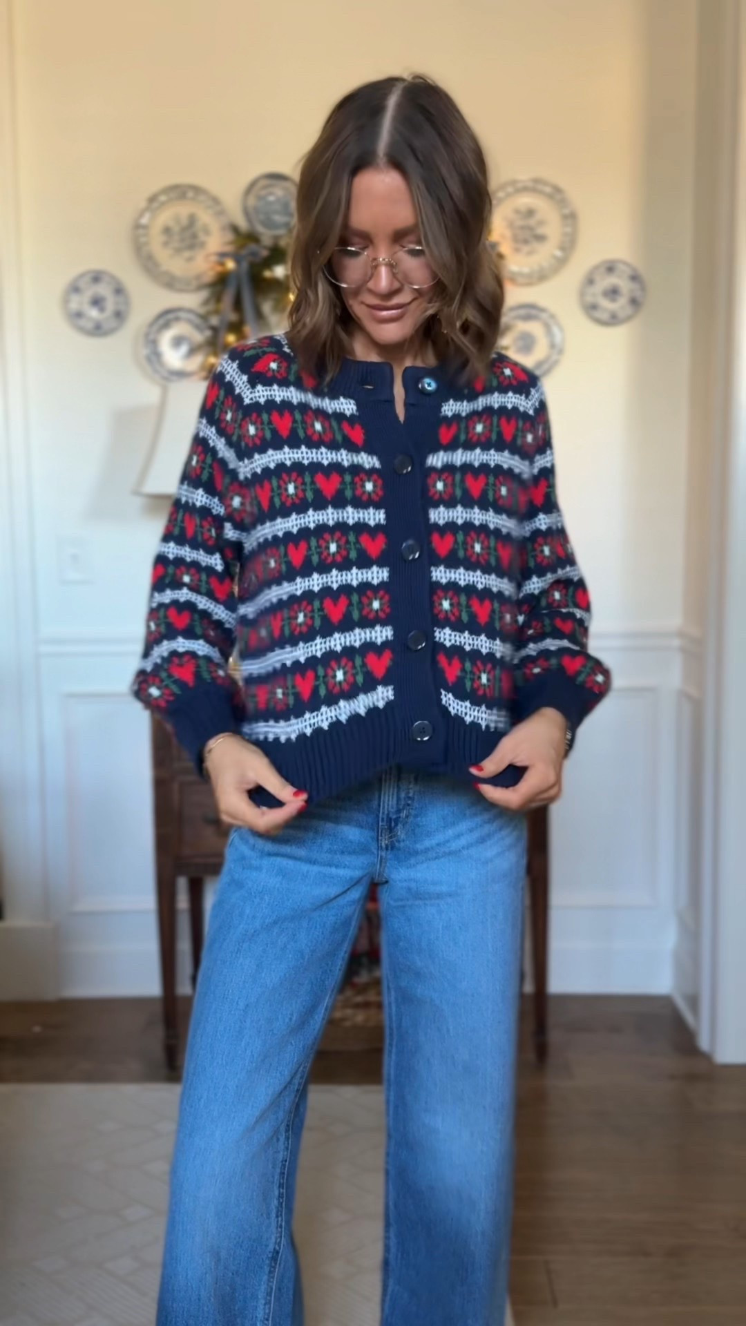 S in fair isle sweater 
S in red sweater and grey sweater 
Xs in pink sweater 
0 in jeans (I suggest sizing down)
