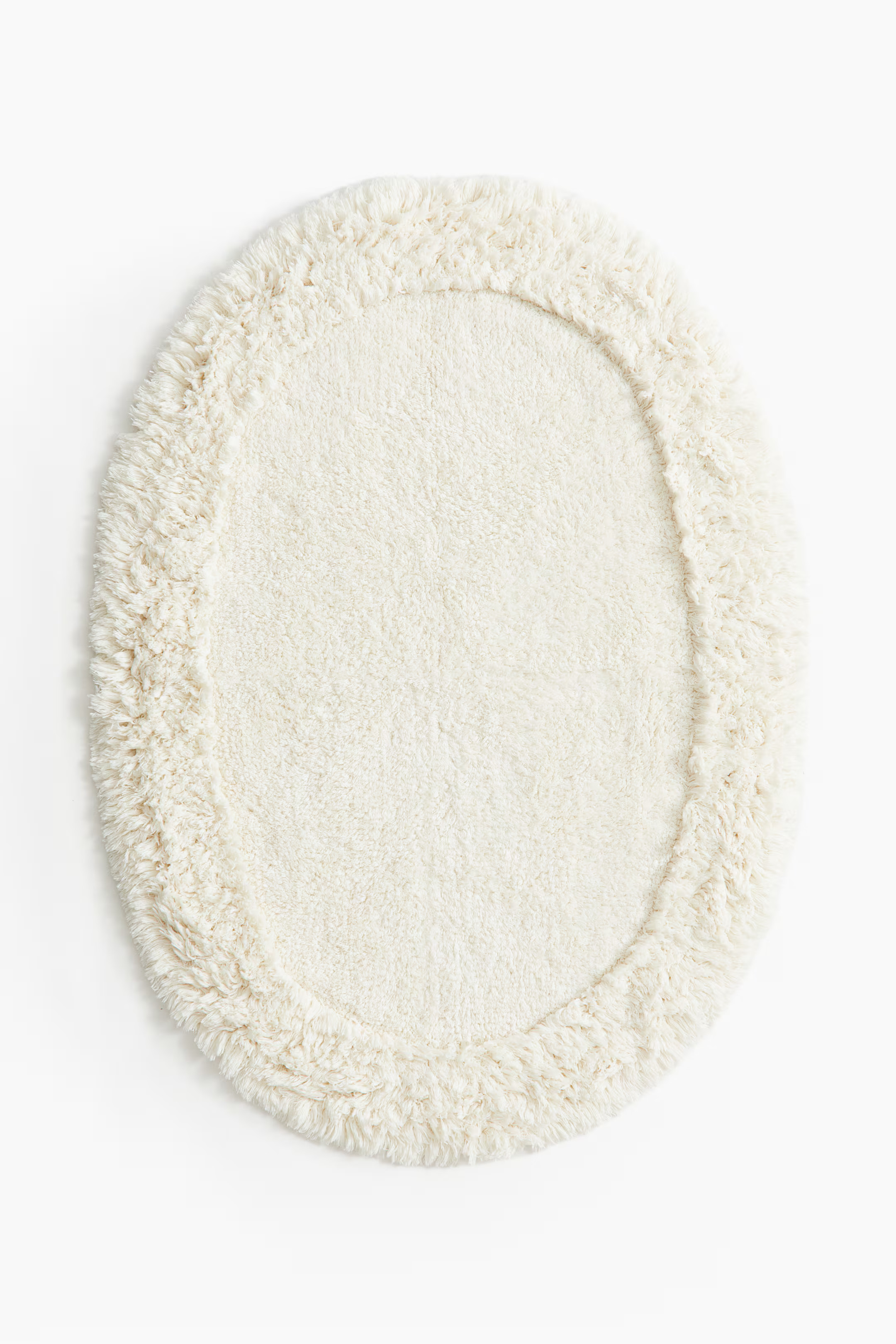Oval tufted bath mat | H&M (UK, MY, IN, SG, PH, TW, HK)