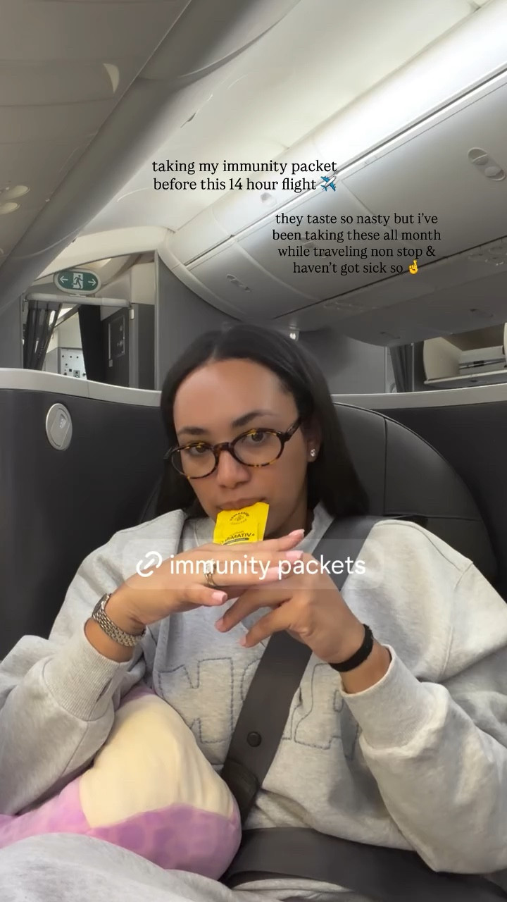 taking my immunity packet before this 14 hour flight ✈️ they taste so nasty but i’ve been taking these all month while traveling non stop & haven’t got sick so 🤞
