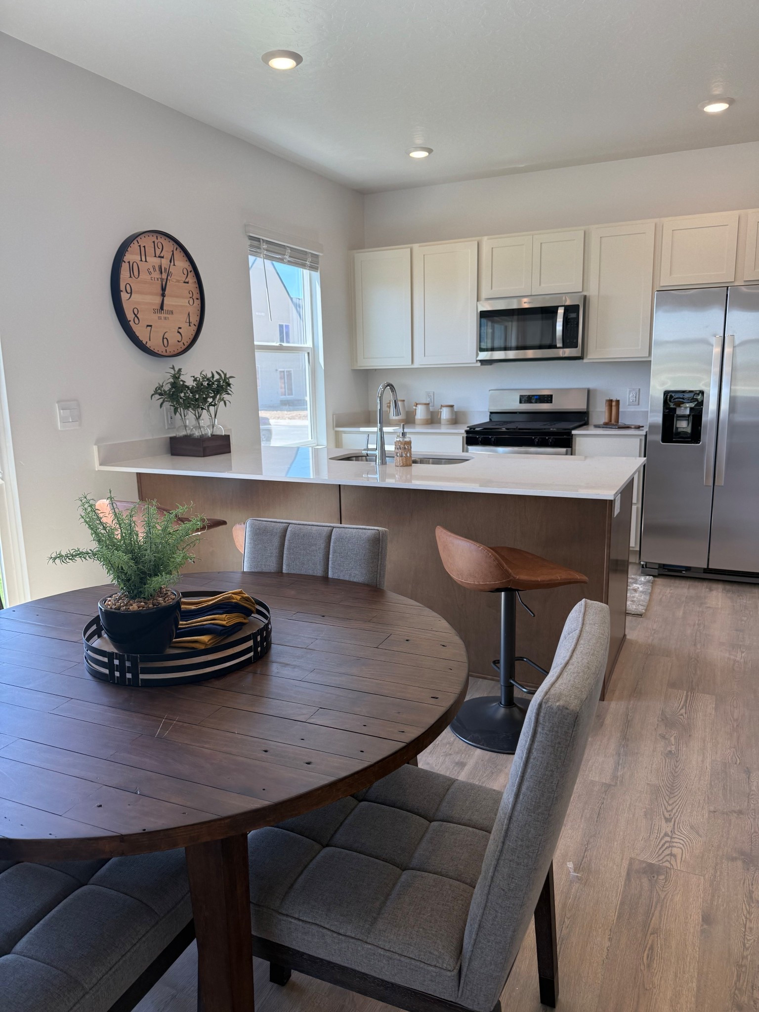 Bright, modern, and functional — this open-concept kitchen and dining space is a dream for everyday living and entertaining. With clean white cabinetry, warm wood tones, stainless steel appliances, and cozy upholstered seating, it blends comfort and style effortlessly. Perfect inspiration for a fresh kitchen makeover or small-space layout ideas! #KitchenInspo #ModernDining #NeutralHomeDecor #OpenConceptLiving #CozyKitchenStyle 

#LTKHome