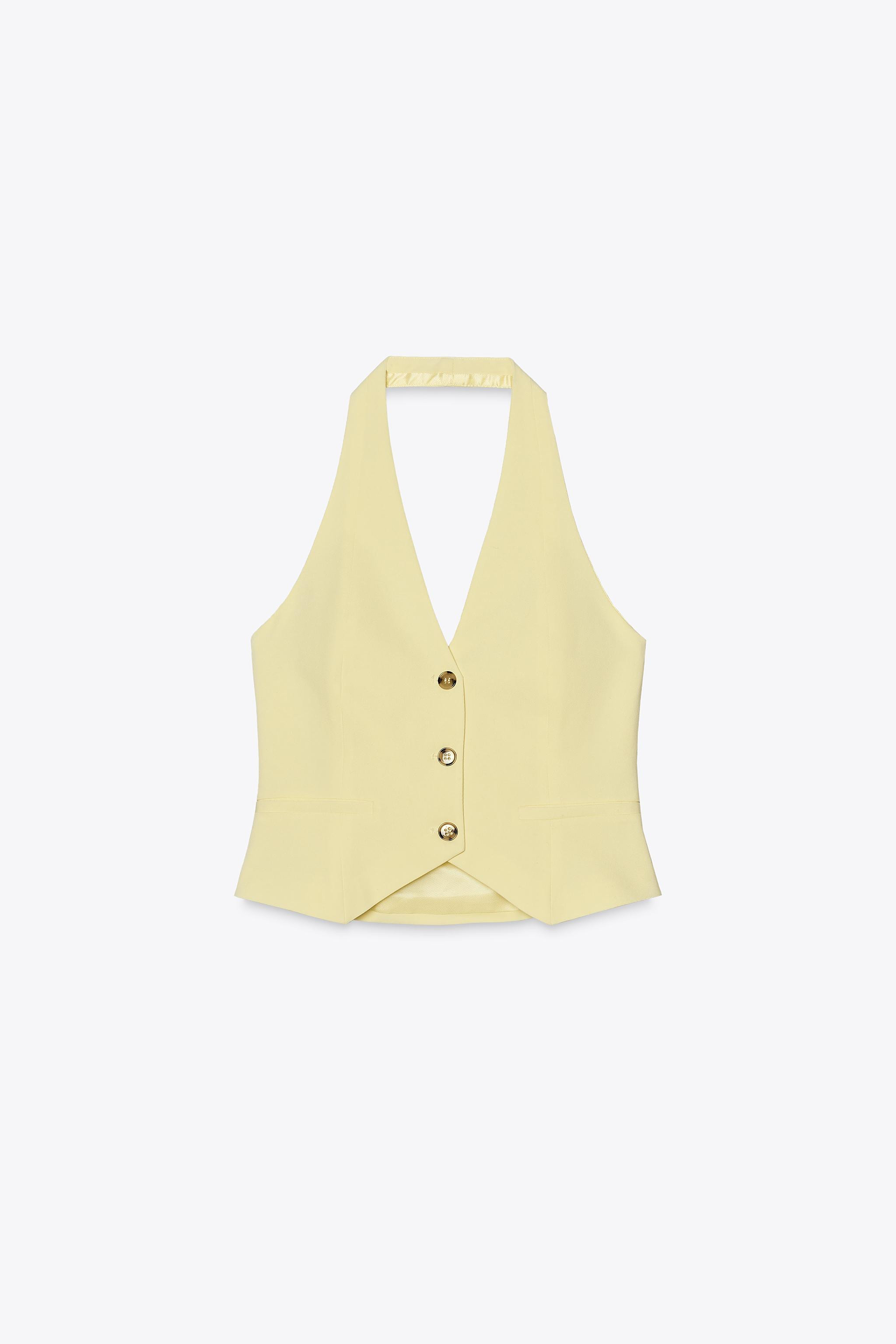 Fitted vest top. Halter neck and V-neckline. Mock welt pockets. Lined. Front button closure. | Zara US