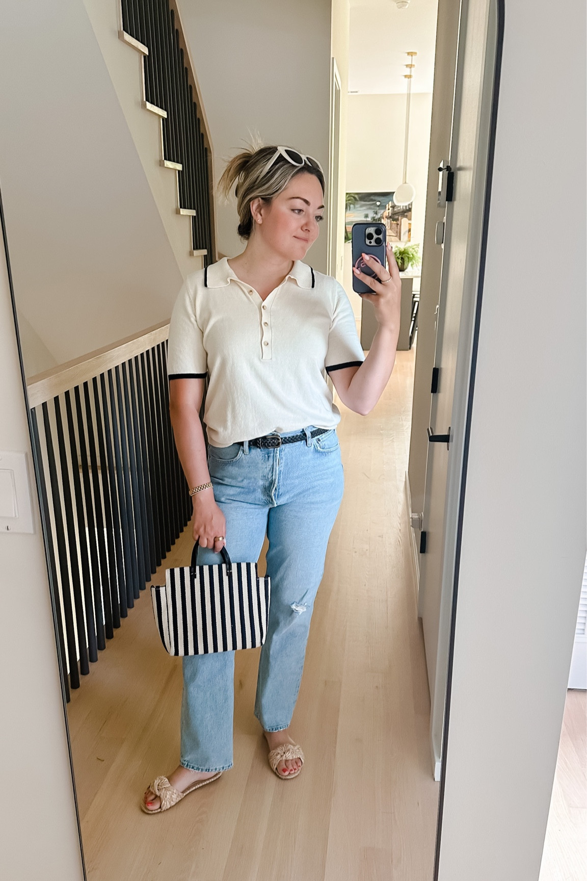 Faherty Polo Sweater - on major sale! I’m wearing a Medium, TTS.

AGolde Jeans - TTS. Size up for a slouchier look.

Linked similar knotted raffia slide sandals, woven leather navy belt (old Gap), Clare V striped mariner tote (sold out)

#LTKFind #LTKSeasonal #LTKsalealert