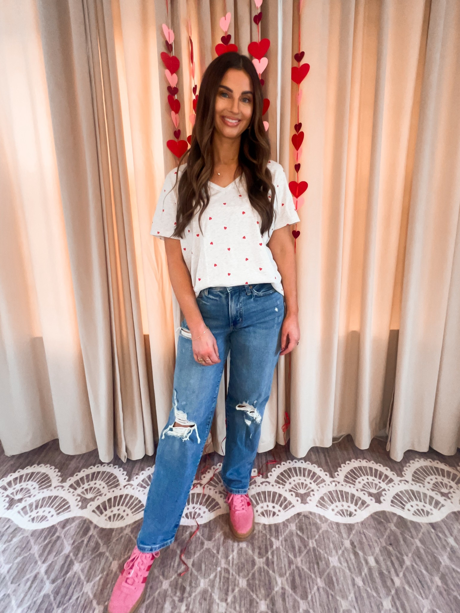 Heather grey vneck tee shirt with little red hearts-large
High waited ripped jeans
Pink and red platform gazelles