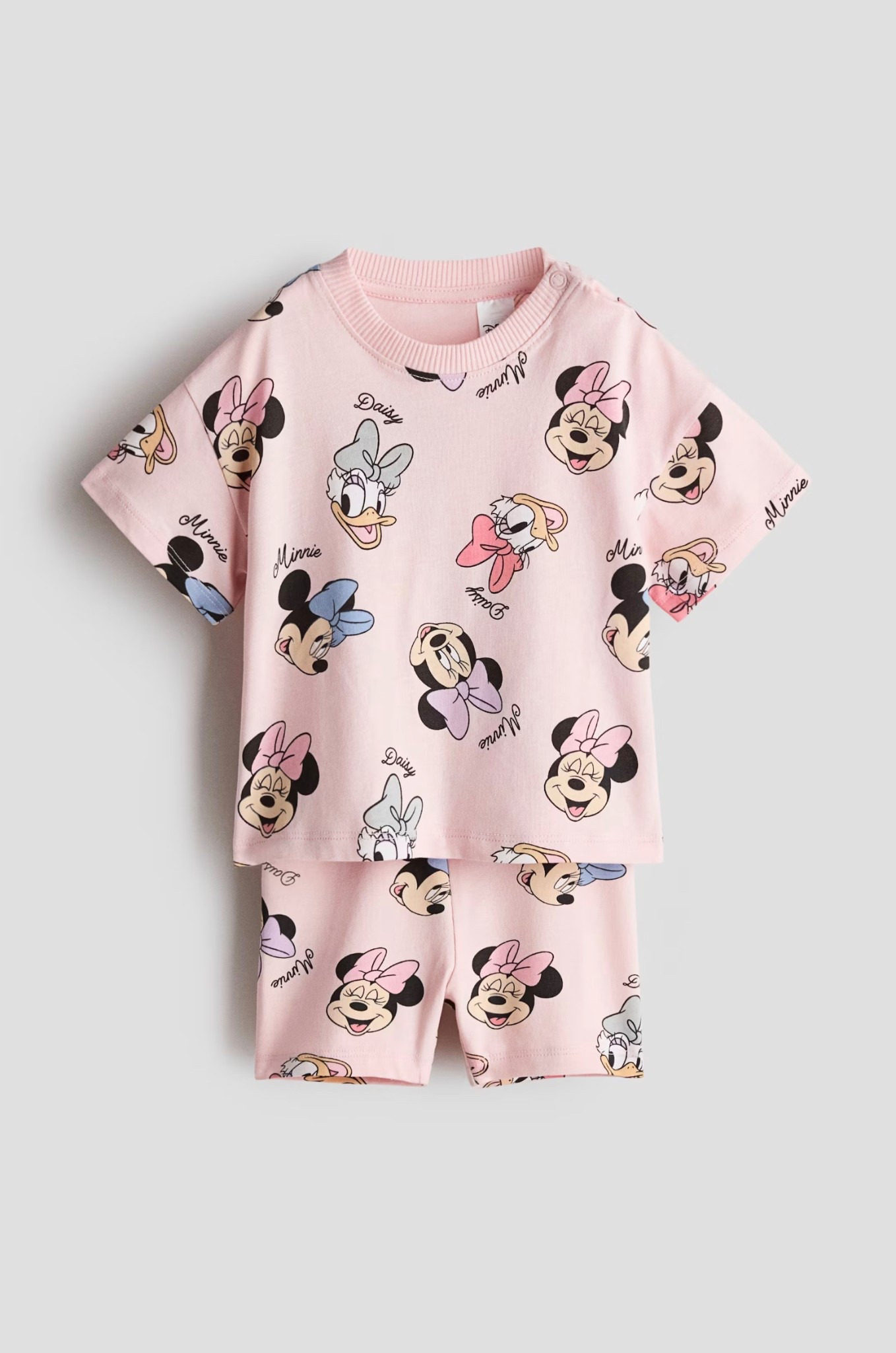 🌸 Sweet & Playful Minnie Mouse 2-Piece Set 🌸
This darling little outfit is a 2-piece printed cotton set perfect for warm weather playdates and park days! It features a soft, lightweight cotton jersey T-shirt with a round ribbed neckline and easy snap closures at the shoulder, plus coordinating bike shorts with an adjustable elastic waistband for comfort all day long. The set is covered in a fun, colorful Minnie Mouse & Daisy Duck print that adds tons of playful style to her wardrobe. 🐭💖

#LTKTravel #LTKKids