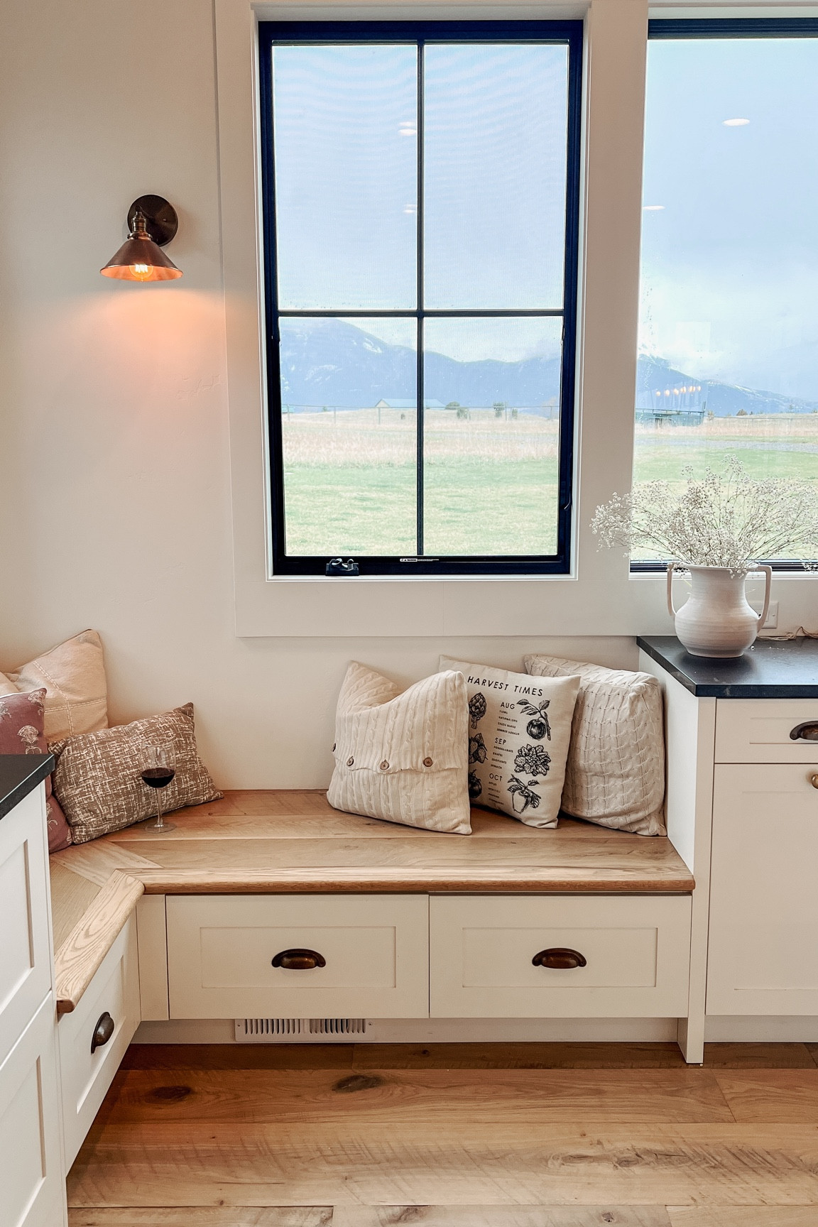 Who doesn’t love a bench in the kitchen? Coffee in the morning, watching the mountains and join the chef for a glass of wine at night!!

Kitchen design 
Built-in bench
Kitchen bench
Kitchen layout 
Bench with pillows 
Coffee spot 
Morning coffee 
Hidden drawers 
Custom kitchen

#LTKHome