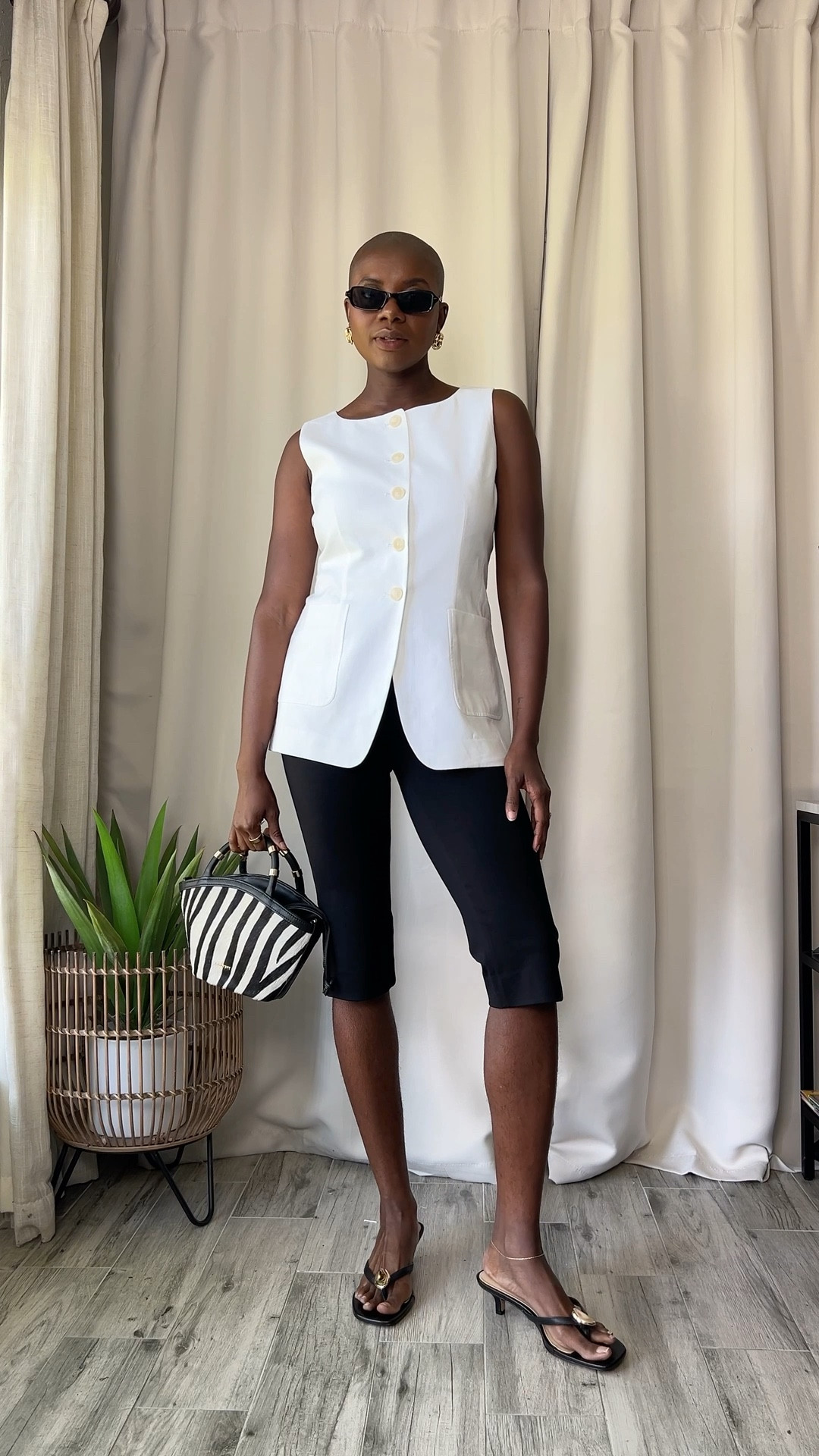 90’s minimalist pieces from Ann Taylor! White button up shirt, black capri pants, white linen vest, and belted trench vest and black kitten heel sandals with a zebra print purse  


#LTKTravel #LTKWorkwear #LTKdayinmylife