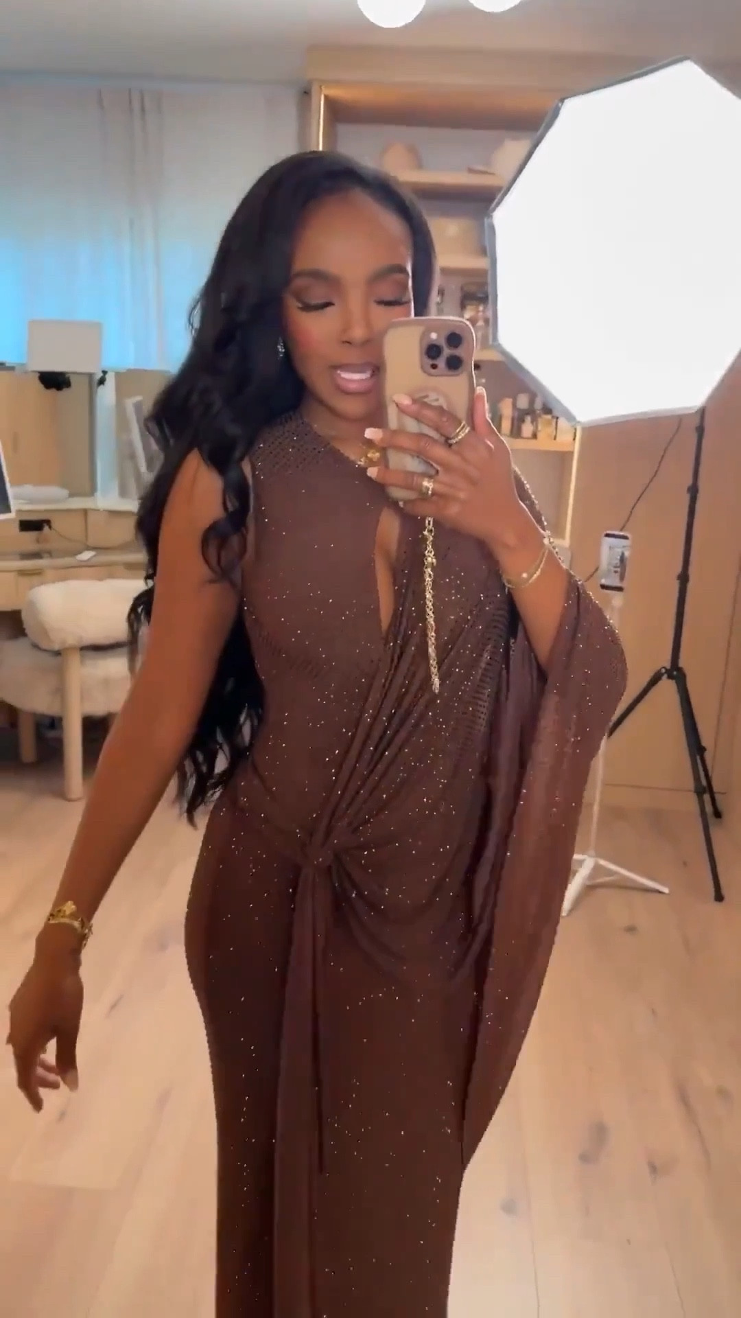 @Meshki brown sparkle gown — a draped, embellished silhouette that feels effortlessly elegant. The keyhole detail and wrap-style draping create a statuesque shape that photographs beautifully while still feeling elevated and timeless.

This is one of those gowns that does all the work for you — bold, flattering, and designed to make a statement without trying too hard.

Perfect for winter galas, holiday parties, formal evenings, and any event that calls for a standout look.

📏 Sizing: Small
📏 Measurements: 5’4” · 138 lbs · 34D · 27” waist · 40” hips

New Year’s Eve outfit ideas, Meshki gown outfit ideas, brown holiday dress inspiration, winter formal looks, elegant evening style, glamorous special-occasion outfits, embellished evening gowns, draped maxi dresses.

✨ Everything linked below for easy shopping

Follow me on Instagram and YouTube @kirasfashionfinds

#LTKHoliday #LTKPetite #LTKootd