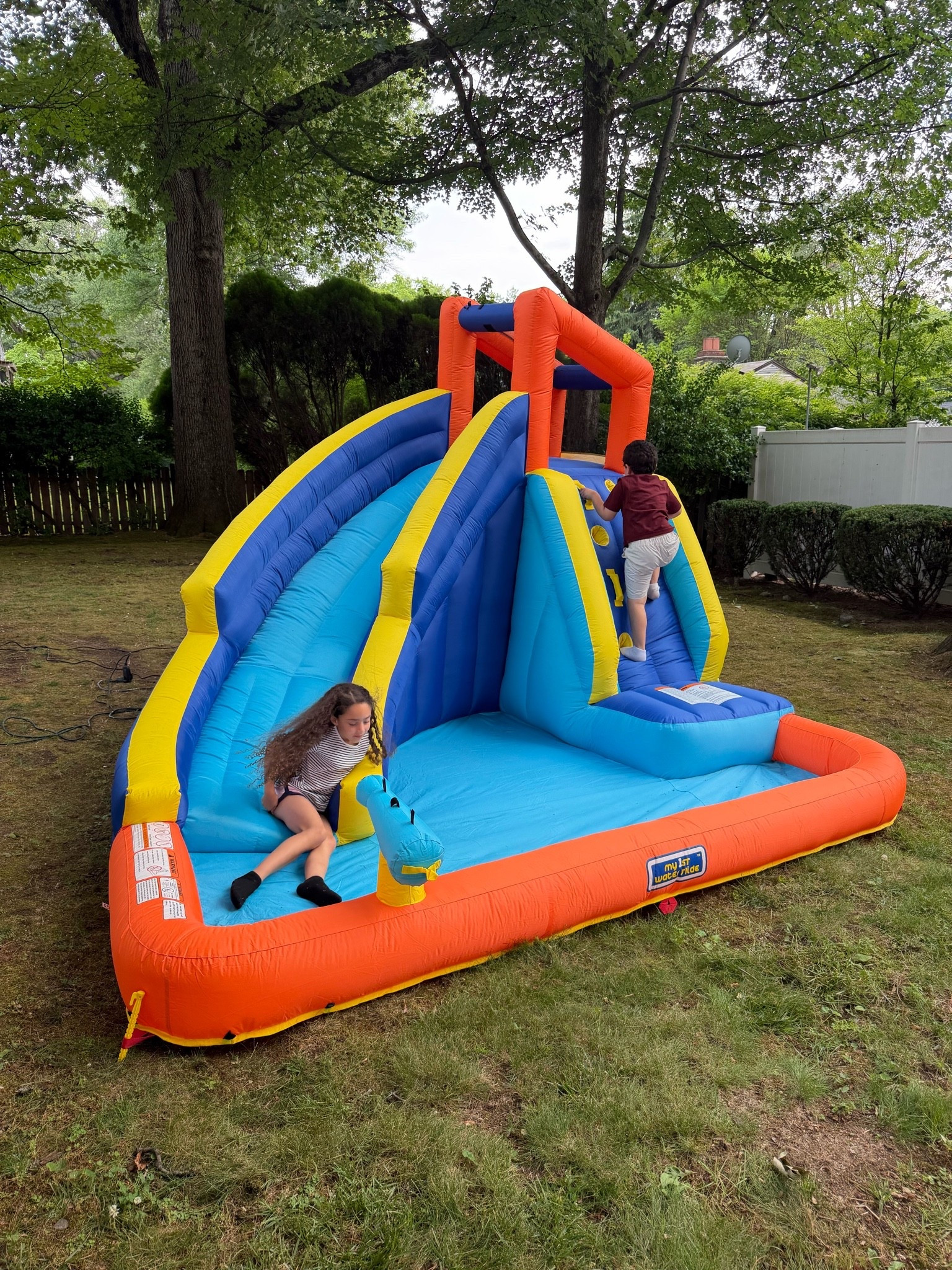 Fun water slide / bounce house for backyard summer fun days!